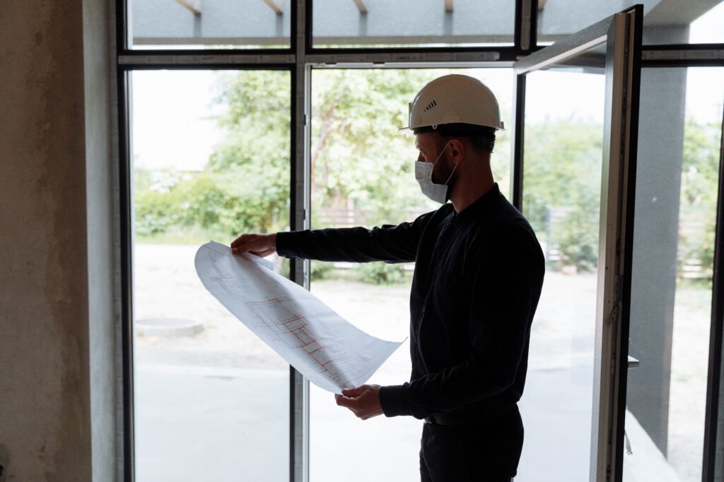 Site pic, construction worker reviewing documentation